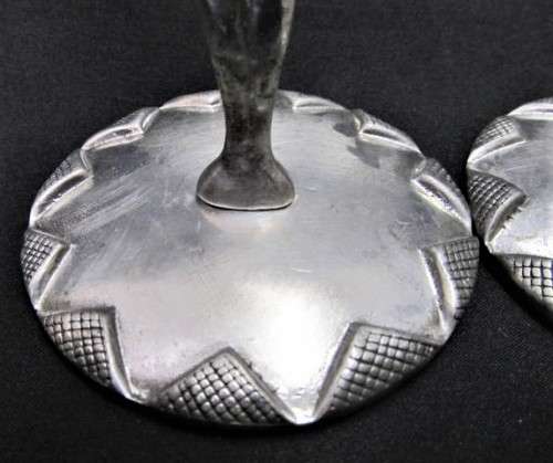 A pair of candlesticks by Carrol Boyes