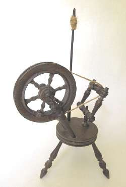 Vintage wooden model of a spinning wheel