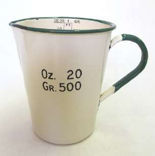 Cream and green enamel measuring jug
