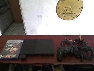 Sony Playstation 2  + Cables + 1 Remote Control + 1 Game + 8mb Memory Card
