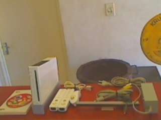 Nintendo Wii  + 2 x Controls + 1 x Nunchucks + Motion Sensor + All Cables + 1 Game