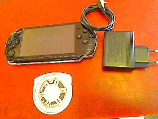 Sony PSP + Charger + Game