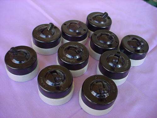 10 Light switches, bakelite & porcelain, 1950ties,  never used. Bid as a lot.