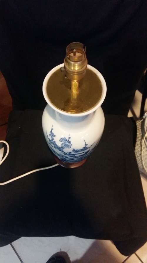 Stunning Oriental Blue and White Porcelain Lamp on carved wooden Base.