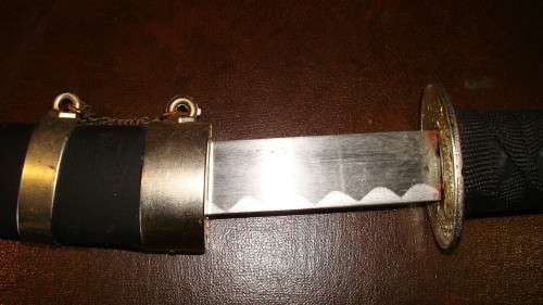 STUNNING SET OF METAL SAMURAI SWORDS ON A DISPLAY STAND