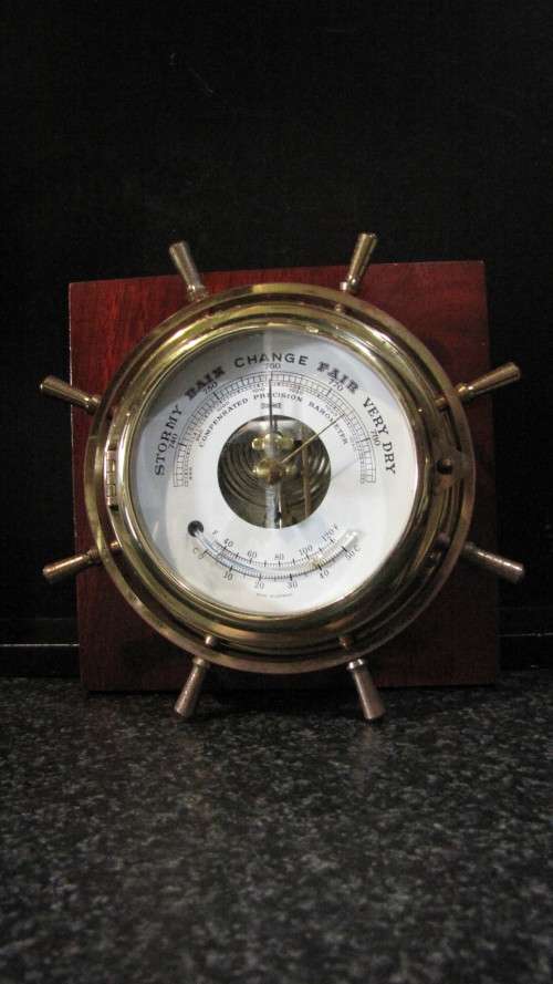 STUNNING GERMAN STOCKBURGER SHIPS WHEEL BAROMETER ON A WOODEN BASE IN FULL WORKING ORDER