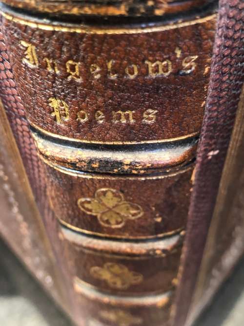 ANTIQUE HARDCOVER GILT EDGED LEATHER BOUND AND RIBBED BOOK - POEMS BY JEAN INGELOW 1867