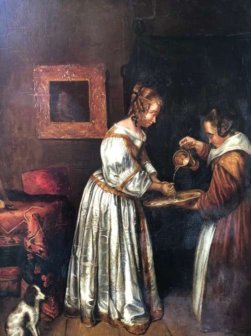 18th/19th CENTURY CONTINENTAL SCHOOL OIL PAINTING ON A WOOD PANEL - LADY WASHING HER HANDS - FRAMED