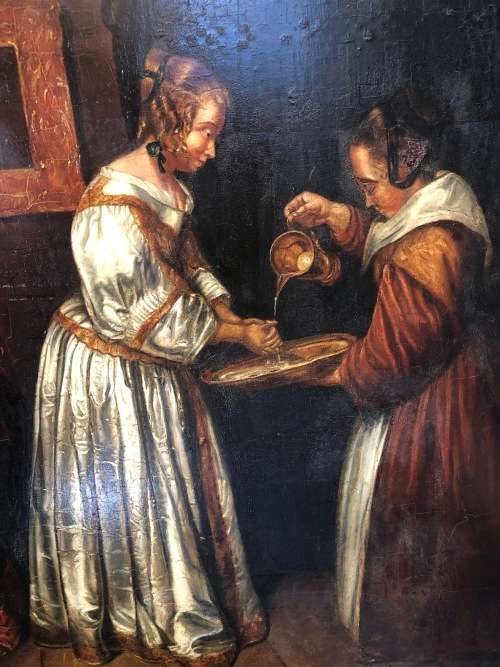 18th/19th CENTURY CONTINENTAL SCHOOL OIL PAINTING ON A WOOD PANEL - LADY WASHING HER HANDS - FRAMED