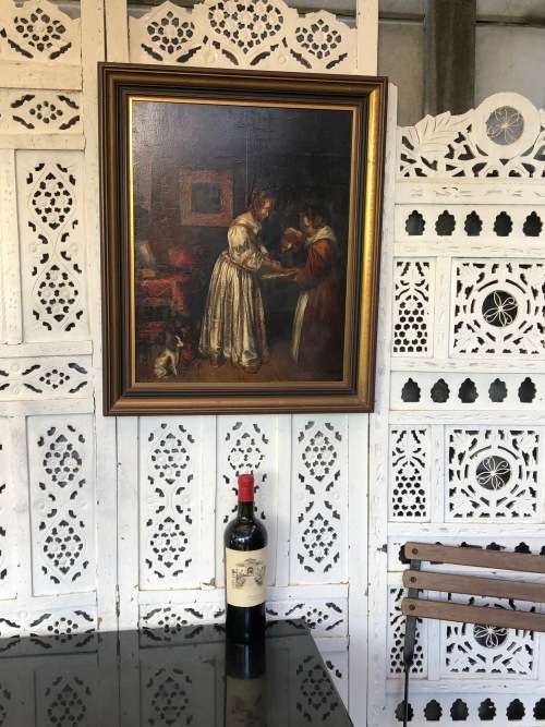 18th/19th CENTURY CONTINENTAL SCHOOL OIL PAINTING ON A WOOD PANEL - LADY WASHING HER HANDS - FRAMED