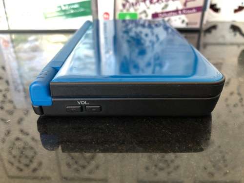 NINTENDO DSi XL GAME CONSOLE IN ORIGINAL BOX WITH CHARGER AND MANUAL FULL WORKING ORDER WITH 2 GAMES