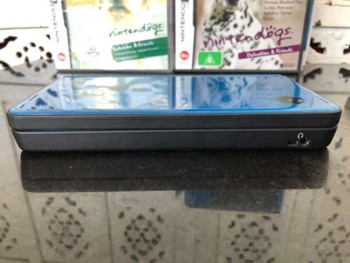 NINTENDO DSi XL GAME CONSOLE IN ORIGINAL BOX WITH CHARGER AND MANUAL FULL WORKING ORDER WITH 2 GAMES