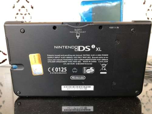 NINTENDO DSi XL GAME CONSOLE IN ORIGINAL BOX WITH CHARGER AND MANUAL FULL WORKING ORDER WITH 2 GAMES