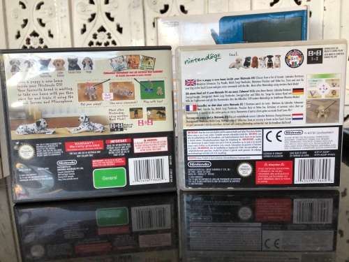 NINTENDO DSi XL GAME CONSOLE IN ORIGINAL BOX WITH CHARGER AND MANUAL FULL WORKING ORDER WITH 2 GAMES