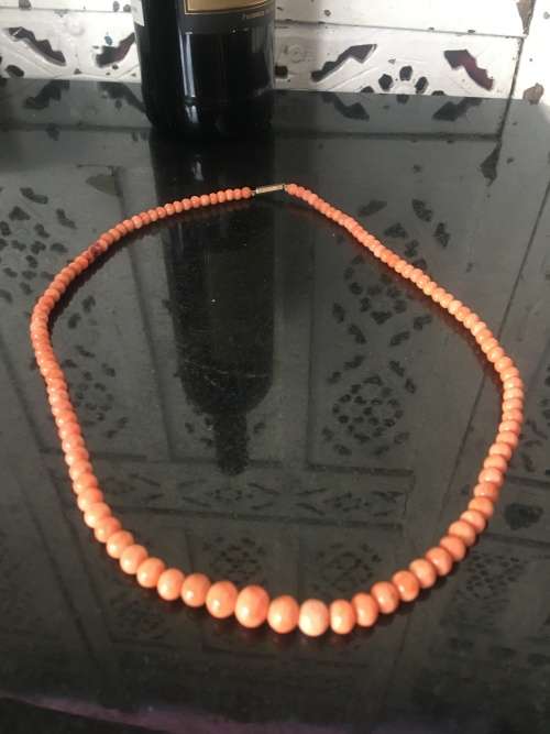 Genuine Natural Antique Salmon Coral Beaded Necklace with gold clip in clasp.
