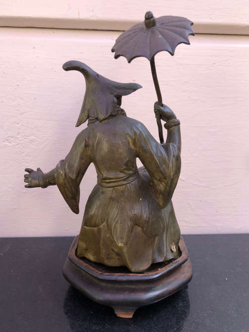 Amazing heavy cast bronze Chinese figurine on a wooden base