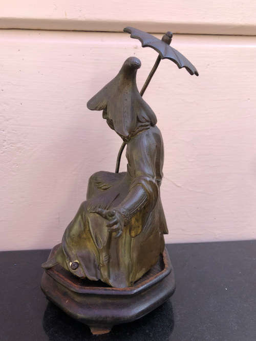 Amazing heavy cast bronze Chinese figurine on a wooden base