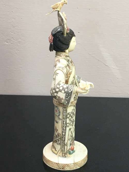 Japanese Bone Geisha figurine sculpted hand decorated. 28 cm tall  moving arm and bird