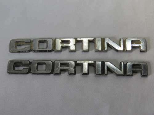 Pair of vintage Ford Cortina badges