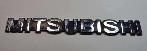 Vintage Mitsubishi name badge