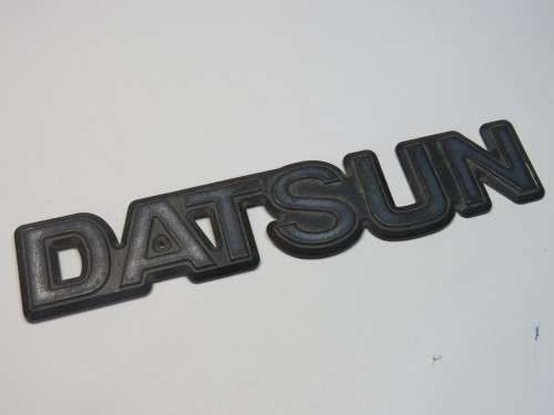 Vintage DATSUN plastic car badge