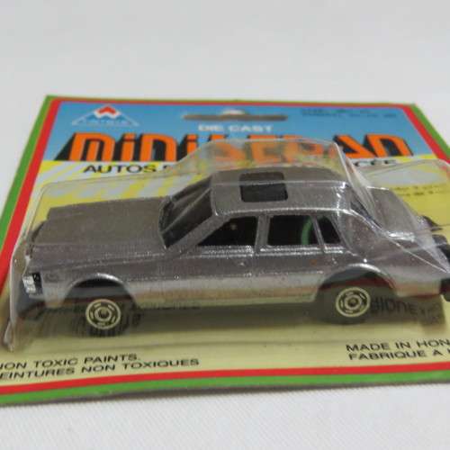 Vintage TinToys die cast mini sedan toy car in pack