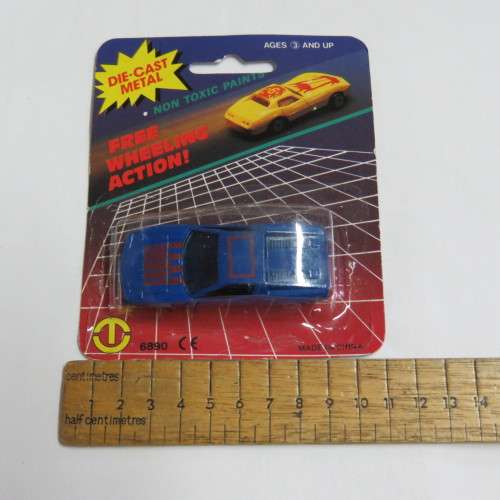 Vintage Die cast metal Free Wheeling action toy car in pack