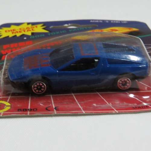 Vintage Die cast metal Free Wheeling action toy car in pack