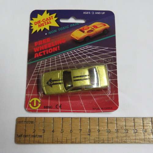 Vintage Free Wheeling Action die cast metal toy car in pack