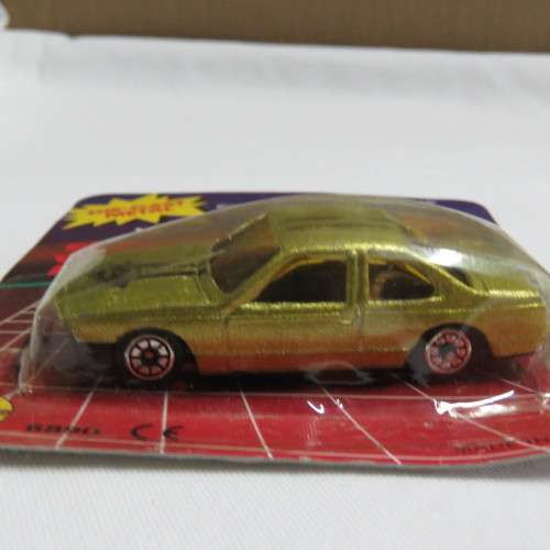 Vintage Free Wheeling Action die cast metal toy car in pack
