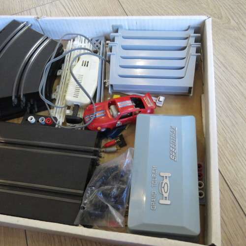 Box with parts for Speedtrax slot car battery operated set - Only 1 car and controller