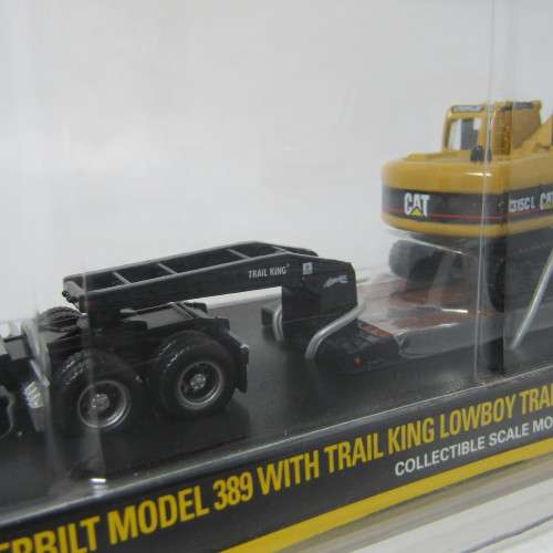 Norscot Peterbilt model 389 with trail king Lowboy trailer and CAT 315C