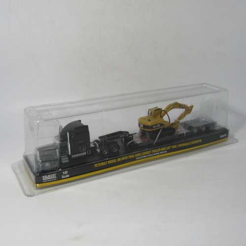 Norscot Peterbilt model 389 with trail king Lowboy trailer and CAT 315C