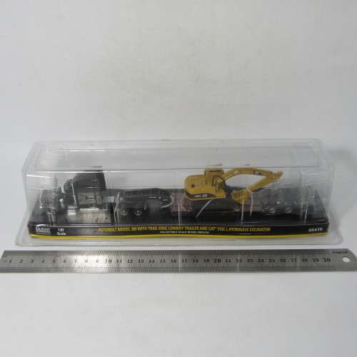 Norscot Peterbilt model 389 with trail king Lowboy trailer and CAT 315C