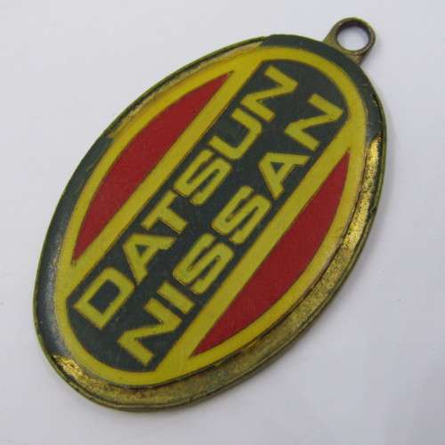 Vintage Datsun Nissan keyring holder - some damage
