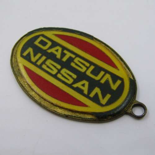 Vintage Datsun Nissan keyring holder - some damage