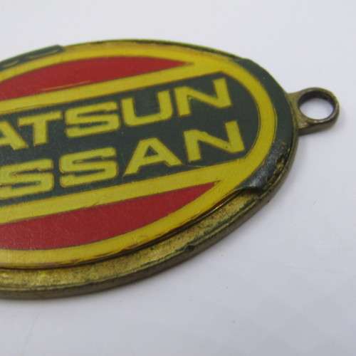 Vintage Datsun Nissan keyring holder - some damage