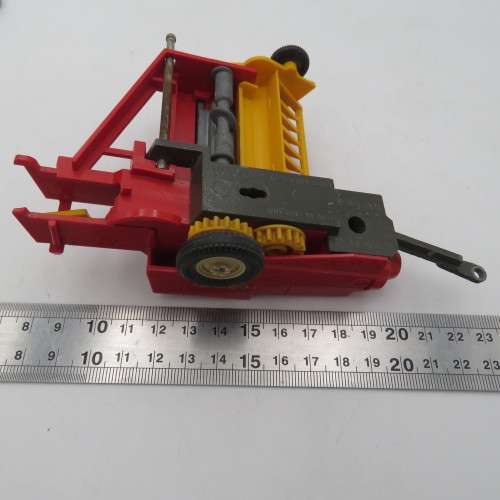 Britain`s New Holland 376 baler - one wheel broken