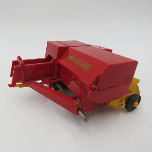 Britain`s New Holland 376 baler - one wheel broken