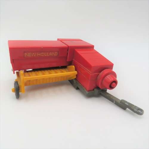 Britain`s New Holland 376 baler - one wheel broken