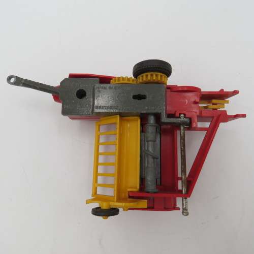 Britain`s New Holland 376 baler - one wheel broken