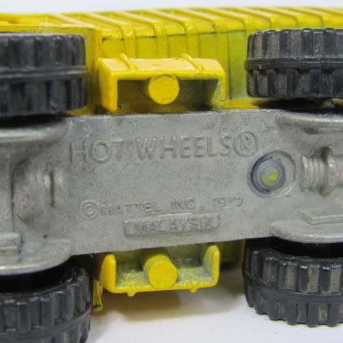 Hot Wheels Caterpillar dump truck toy car