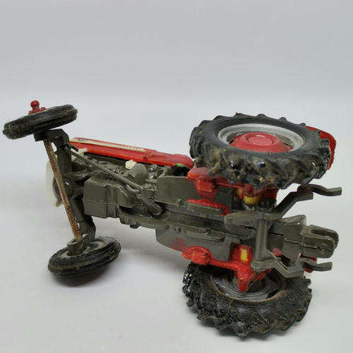 Britains Ltd Massey - Ferguson 135 die-cast tractor - scale 1/32 - front left wheel repaired