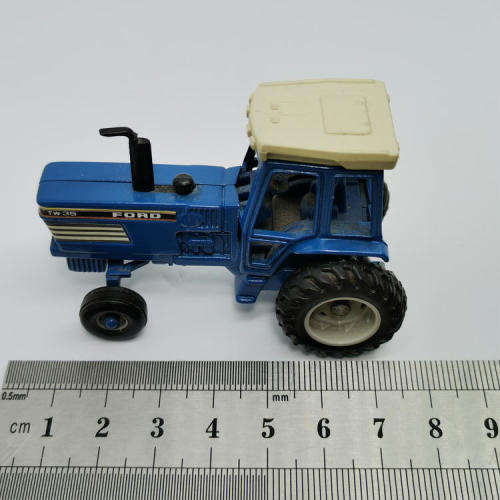 ERTL Ford TW-35 tractor with baler - scale 1/64