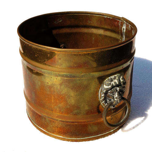Vintage brass bucket with lion head handles