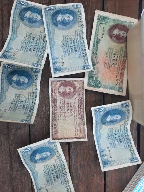 old silver coins and notes