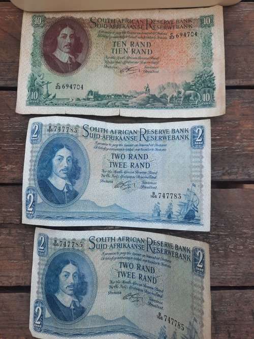 old silver coins and notes