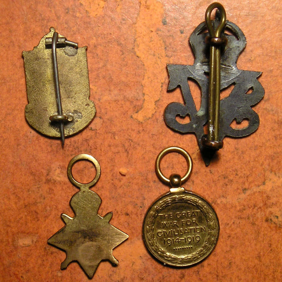 Two WW1 Miniature medals; Two WW2 Badges; Mystery object