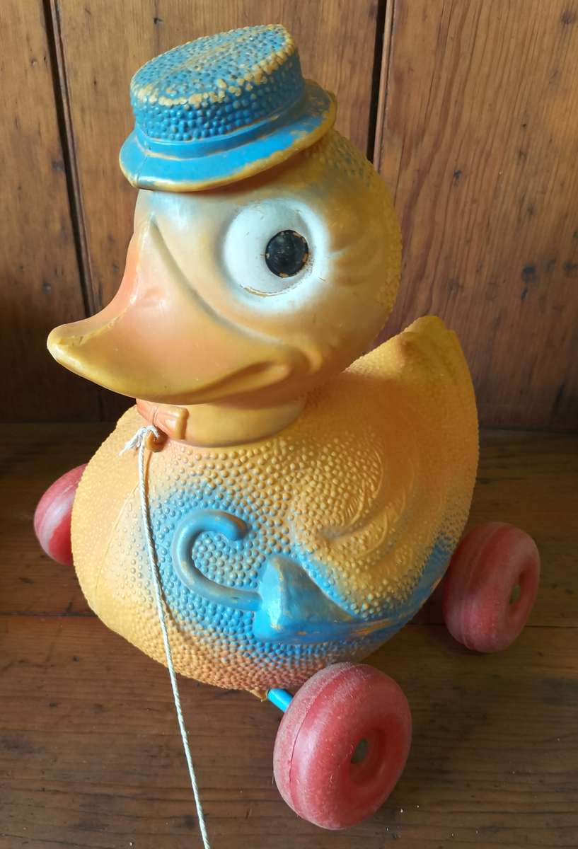 Vintage plastic pull-along duck on wheels