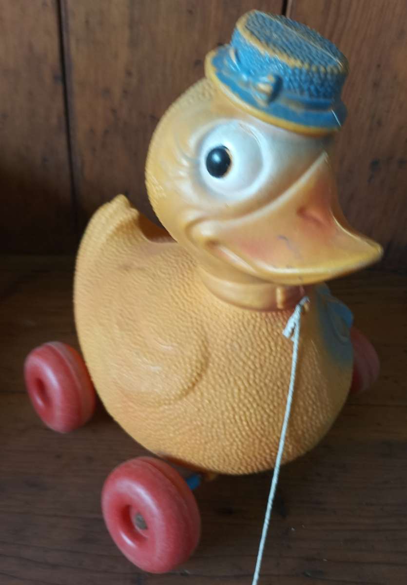 Vintage plastic pull-along duck on wheels